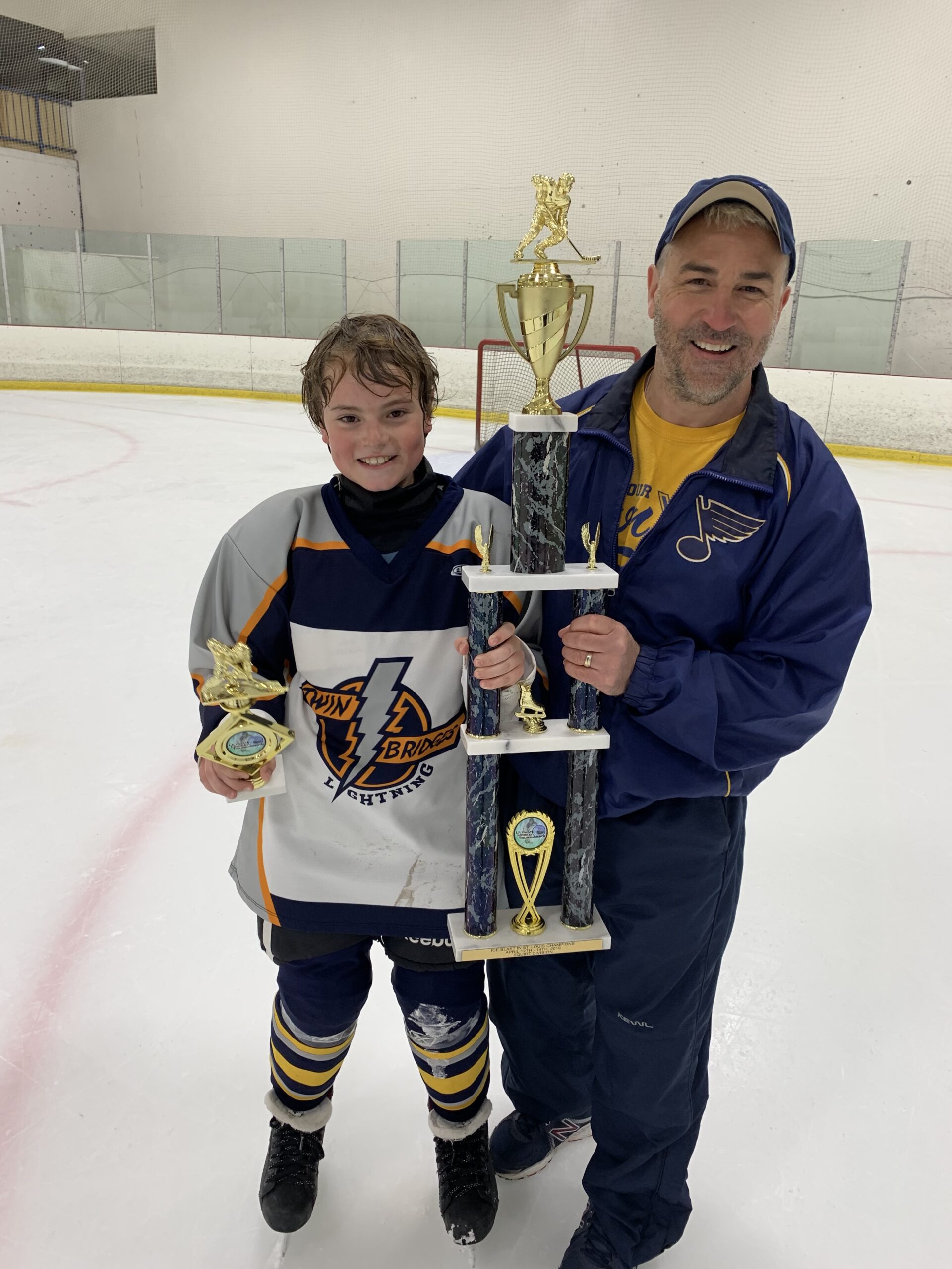 Me & Emmitt Holding Championship Trophy (Hockey)